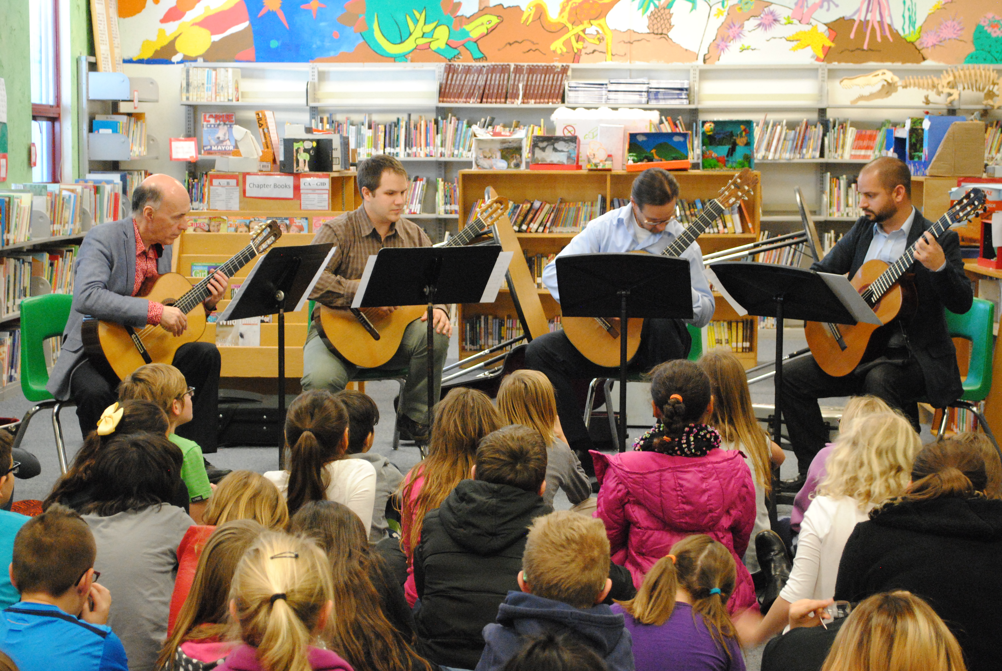 Lead Guitar guest artists perform for an elementary school